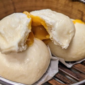 Happy Corner 13 - See the yolk oozing? Not to be confused with the egg custard bun, this one is runny - Chinese Near Me - Oakland Gardens, New York Happy Corner 13 - See the yolk oozing? Not to be confused with the egg custard bun, this one is runny - Chinese Near Me - Oakland Gardens, New York
