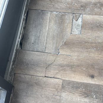 Sunset Lake - Broken floor boards in the entry way. Not fixed after months. - Apartments Near Me - Justice, Illinois