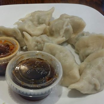 Lili's Restaurant - Steamed pork dumplings with leek, chili oil and black vinegar dip. - Chinese Near Me - Amherst, Massachusetts Lili's Restaurant - Steamed pork dumplings with leek, chili oil and black vinegar dip. - Chinese Near Me - Amherst, Massachusetts