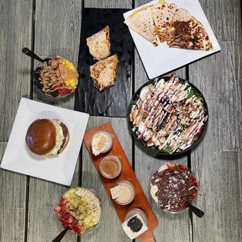 District Eatz - a variety of food on a table - Acai Bowls Near Me - Clifton, Virginia