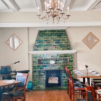 Revival on Lincoln - a dining room with a fireplace - New American Near Me - Pittsburgh, Pennsylvania Revival on Lincoln - a dining room with a fireplace - New American Near Me - Pittsburgh, Pennsylvania