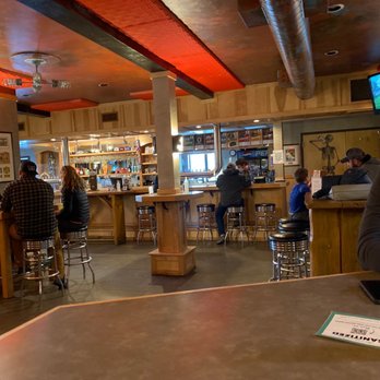 Bayern Brewing - a man sitting at a bar - Breweries Near Me - Missoula, Montana Bayern Brewing - a man sitting at a bar - Breweries Near Me - Missoula, Montana