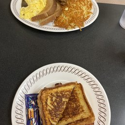 Breakfast sandwich and egg and hash browns. Breakfast sandwich and egg and hash browns.