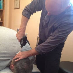 Tenenbaum Chiropractic - Working on my husband's neck