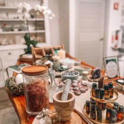 Kalma Spa - Treatment station at K'Alma Spa in Miami Beach, set with herbs, botanicals, glass jars, and a mortar and pestle.