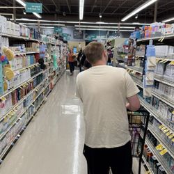 Safeway - Self checkout line all the way down the aisle and the 1 open check stand backed up just as far.