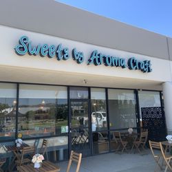 Storefront with some bistro tables outside