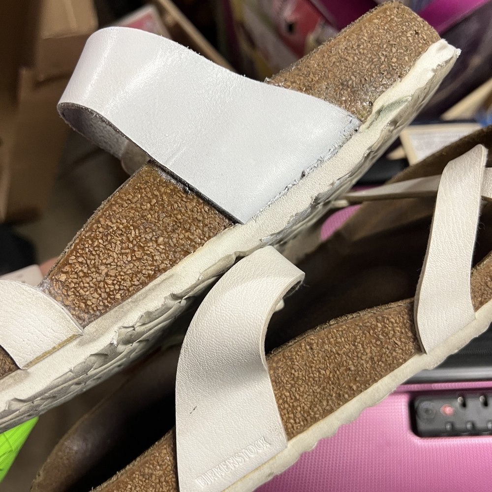 Bottom of the repaired shoe is buldging and glue still all over the place (this is after I asked if he could clean up the glue everywhere) Bottom of the repaired shoe is buldging and glue still all over the place (this is after I asked if he could clean up the glue everywhere)