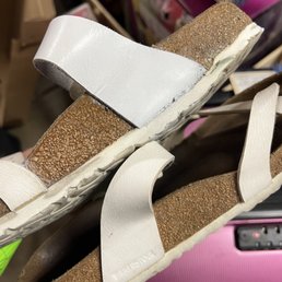 Bottom of the repaired shoe is buldging and glue still all over the place (this is after I asked if he could clean up the glue everywhere)