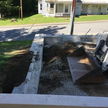 Roundy's Paving - The larger and more visible retaining wall under construction - Masonry/Concrete Near Me - Newport, Maine