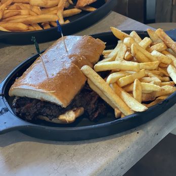 Romi's Brew & BBQ - BBQ tri tip sandwich with fries - Barbeque Near Me - Nice, California Romi's Brew & BBQ - BBQ tri tip sandwich with fries - Barbeque Near Me - Nice, California