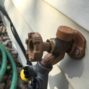 E-Z Plumbing - a close up of a water spigot attached to the side of a house - Plumbing Near Me - Verona, Wisconsin E-Z Plumbing - a close up of a water spigot attached to the side of a house - Plumbing Near Me - Verona, Wisconsin