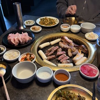Meet Korean BBQ - pork jowl & dry aged ribeye (on grill) - Barbeque Near Me - Seattle, Washington