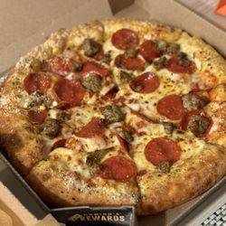 Domino's Pizza - Sausage and pepperoni pizza with cheese filled crust