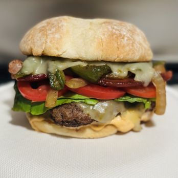 That Burger Guy - The OG Burger, bacon, grilled onions, grilled jalapeños, chipotle mayo, pepper Jack cheese, lettuce and tomato. - Burgers Near Me That Burger Guy - The OG Burger, bacon, grilled onions, grilled jalapeños, chipotle mayo, pepper Jack cheese, lettuce and tomato. - Burgers Near Me
