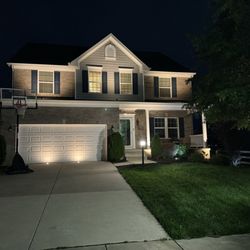 Outdoor Glo - The house at night with the lights.