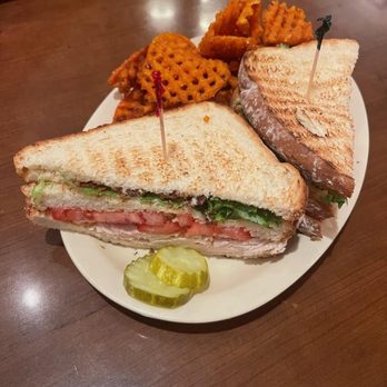 Crystal Beer Parlor - Carved, Turkey with bacon club sandwich and waffle sweet potato fries - Southern Near Me - Savannah, Georgia Crystal Beer Parlor - Carved, Turkey with bacon club sandwich and waffle sweet potato fries - Southern Near Me - Savannah, Georgia