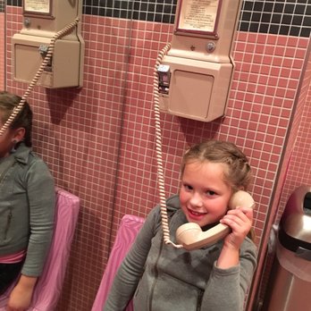 Jim Brady's - "Look mom, it's a pink cellphone!" - American Near Me - Royal Oak, Michigan