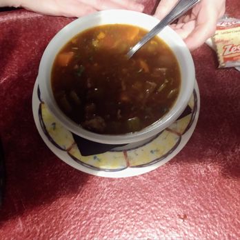 Beach Club Bistro - a bowl of soup with a spoon - Pizza Near Me - Euclid, Ohio