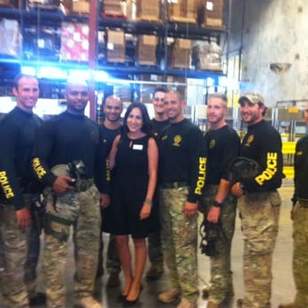 Dining in the Dark - Sasha, from Second Harvest, posing with the SWAT team - Local Flavor Near Me - Orlando, Florida Dining in the Dark - Sasha, from Second Harvest, posing with the SWAT team - Local Flavor Near Me - Orlando, Florida