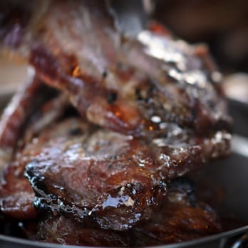The Carbon Grill - a steak being cooked in a pan - Mexican Near Me - Los Angeles, California The Carbon Grill - a steak being cooked in a pan - Mexican Near Me - Los Angeles, California