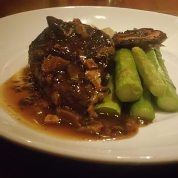 Seasons 52 - Oak Grilled Filet Mignon with a red wine mushroom base, mash potatoes and asparagus. The steak was cooked to perfection. - New American Near Me - Memphis, Tennessee