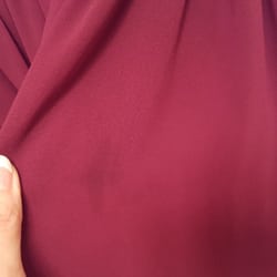 Village Cleaners - Small dark mark just to the left of center. 4 more spots on the dress similar to that.