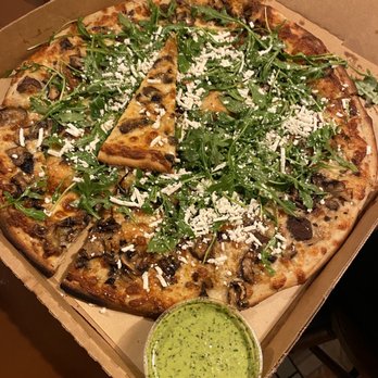 Cheese Board Pizza - Cremini mushroom, mozzarella, ricotta salata cheese, arugula, lemon vinaigrette - Pizza Near Me - Berkeley, California Cheese Board Pizza - Cremini mushroom, mozzarella, ricotta salata cheese, arugula, lemon vinaigrette - Pizza Near Me - Berkeley, California