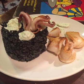 Catalina - Calamari and rice with squid ink - Tapas Bars Near Me - Seville, SE Catalina - Calamari and rice with squid ink - Tapas Bars Near Me - Seville, SE