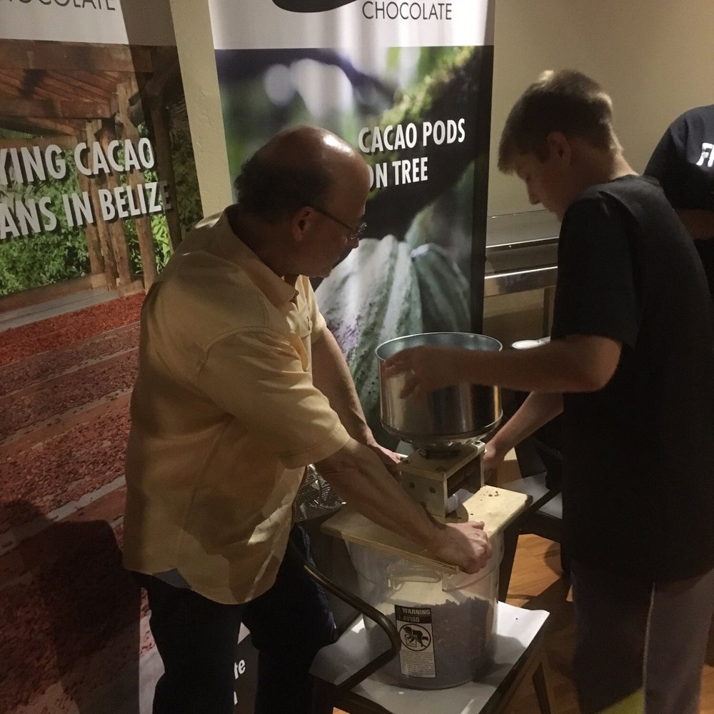 Zak's Chocolate - Cranking the handle for winnowing the cocoa beans at our chocolate making class. - Chocolatiers & Shops Near Me - Scottsdale, Arizona Zak's Chocolate - Cranking the handle for winnowing the cocoa beans at our chocolate making class. - Chocolatiers & Shops Near Me - Scottsdale, Arizona
