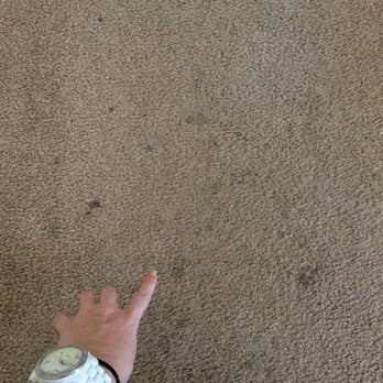 Distinctive Properties - Multiple carpet stains at move in - Real Estate Agents Near Me