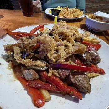 Timberwood Grill - Smothered Steak Tips (over fries instead of mashed potatoes) - Burgers Near Me - Pigeon Forge, Tennessee Timberwood Grill - Smothered Steak Tips (over fries instead of mashed potatoes) - Burgers Near Me - Pigeon Forge, Tennessee