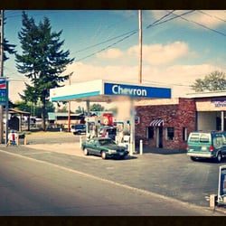 Herb's Chevron - Front view of the gas station and repair shop on a summer day looking up Ferry Street.