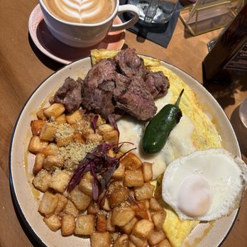 Bistrology - Omelette Diego Rivera, meat and egg Over Medium Parmesan Potatoes - Breakfast & Brunch Near Me - Pensacola, Florida Bistrology - Omelette Diego Rivera, meat and egg Over Medium Parmesan Potatoes - Breakfast & Brunch Near Me - Pensacola, Florida