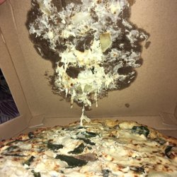 Pizza stuck to box.