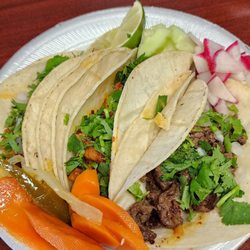 Adoboss Mexican & Chinese Food - Three tacos.
