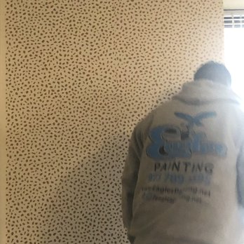 Eagles Painting - Hard at work hanging the removable wallpaper! - Painters Near Me Eagles Painting - Hard at work hanging the removable wallpaper! - Painters Near Me