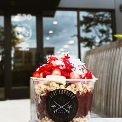 Açai Express - Valentine Bowl - Our pure acai base topped with coconut oil, granola, bananas, Nutella, strawberries and coconut flakes.