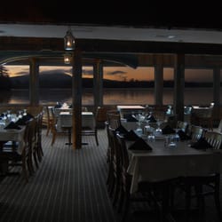 Topside Grille - Topside Grille's dining room has a wall of windows that overlook Huddle Bay, Sweet Briar Island and Buck Mountain.