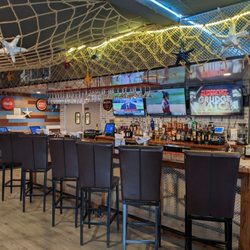 Crafty Crab - The bar with some TVs.