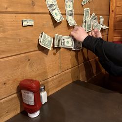 Add our dollars to the wall.