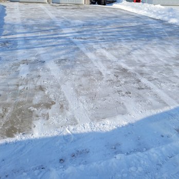 Km Seasonal Services - a driveway covered in snow - Snow Removal Near Me - Winkler, Manitoba Km Seasonal Services - a driveway covered in snow - Snow Removal Near Me - Winkler, Manitoba