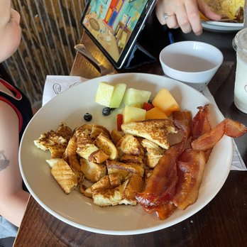 Famous Toastery - Kids French toast with fruit (the bacon is my husbands) - Breakfast & Brunch Near Me - Tega Cay, South Carolina Famous Toastery - Kids French toast with fruit (the bacon is my husbands) - Breakfast & Brunch Near Me - Tega Cay, South Carolina
