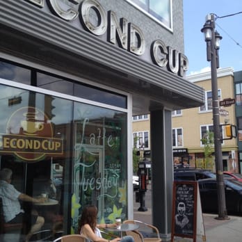 Second Cup On Whyte - a woman sitting at a table outside - Coffee & Tea Near Me - Edmonton, Alberta Second Cup On Whyte - a woman sitting at a table outside - Coffee & Tea Near Me - Edmonton, Alberta