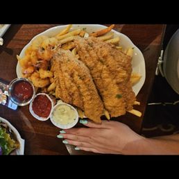 Fried seafood platter with fish, shrimp and fries Fried seafood platter with fish, shrimp and fries