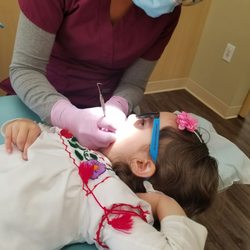 The Smile Shop - My 3yr old getting her teeth cleaned by an excellent staff member.