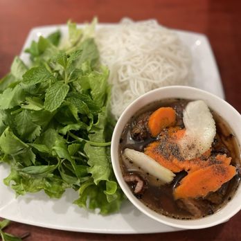 Oh My Pho - a bowl of soup and a plate of noodles - Vietnamese Near Me - Lawndale, California