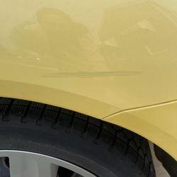 Henry Towing Service - The big scratch on my back passenger tire that was not there as well
