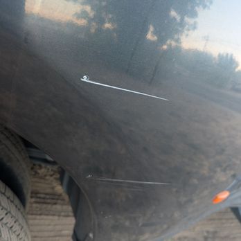 Ez Smog - The side of our truck bed that got scratched by their pole covered in zip ties and a chain. - Smog Check Stations Near Me - Ceres, California Ez Smog - The side of our truck bed that got scratched by their pole covered in zip ties and a chain. - Smog Check Stations Near Me - Ceres, California