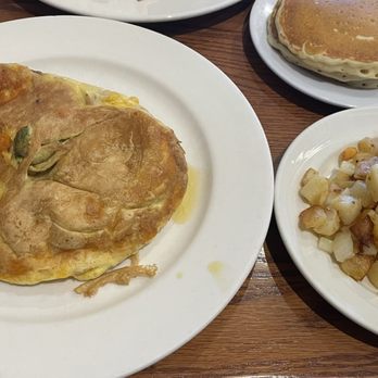 The Original Pancake House - Spicy omelette with 3 buttermilk pancakes and a side of potato! - Breakfast & Brunch Near Me - Fort Worth, Texas